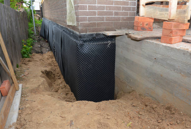 SJ Waterproofing Pros technician performing targeted Waterproofing assessment in Lakewood, OH